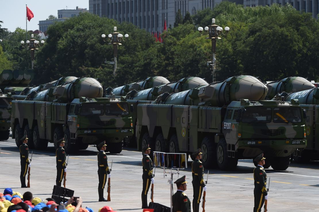 Military vehicles carrying DF-21D missiles, also known as the"carrier-killer" are displayed in a military parade at Tiananmen Square in Beijing on September 3, 2015.