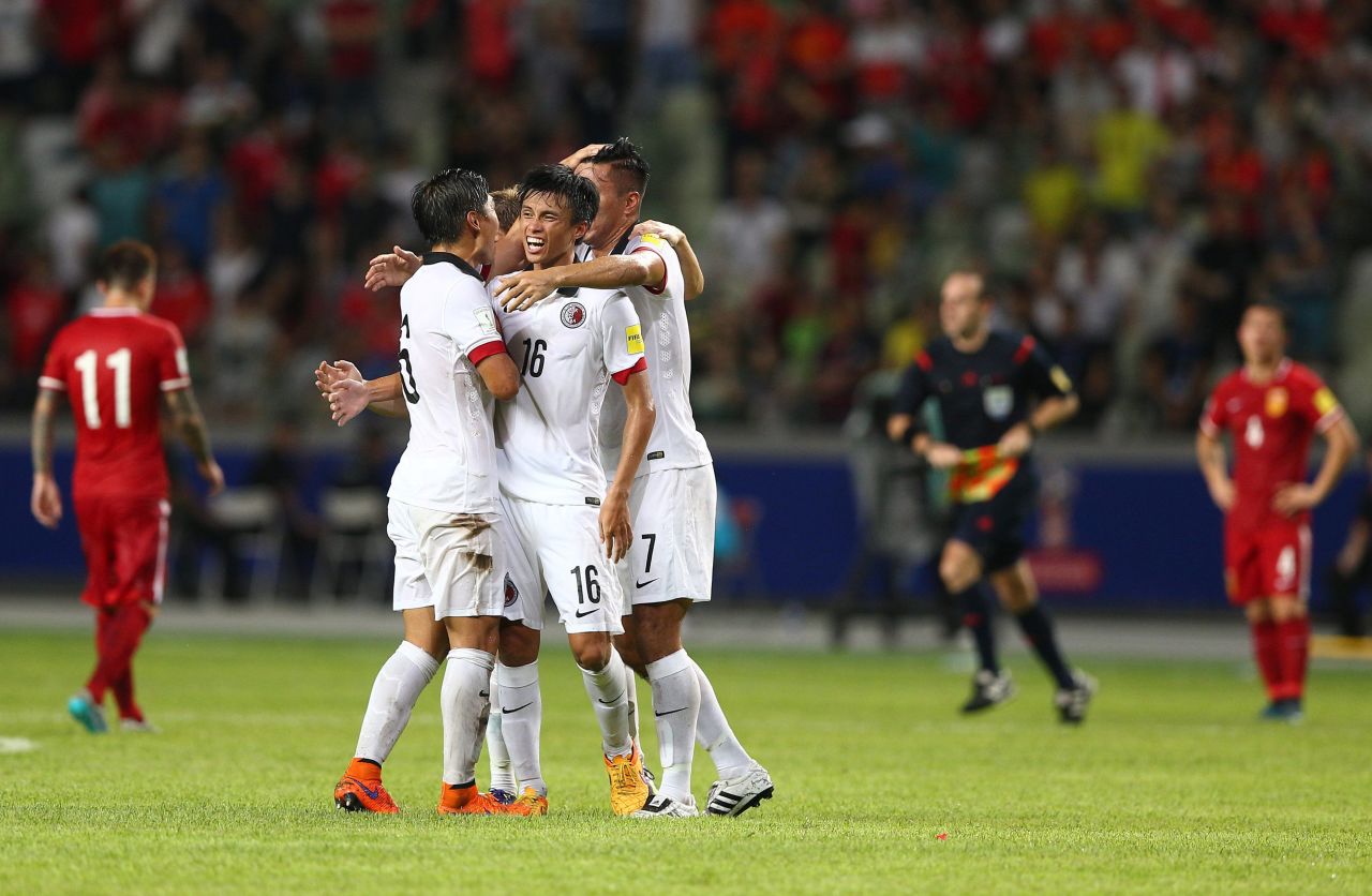 Hong Kong's players celebrate a famous draw.