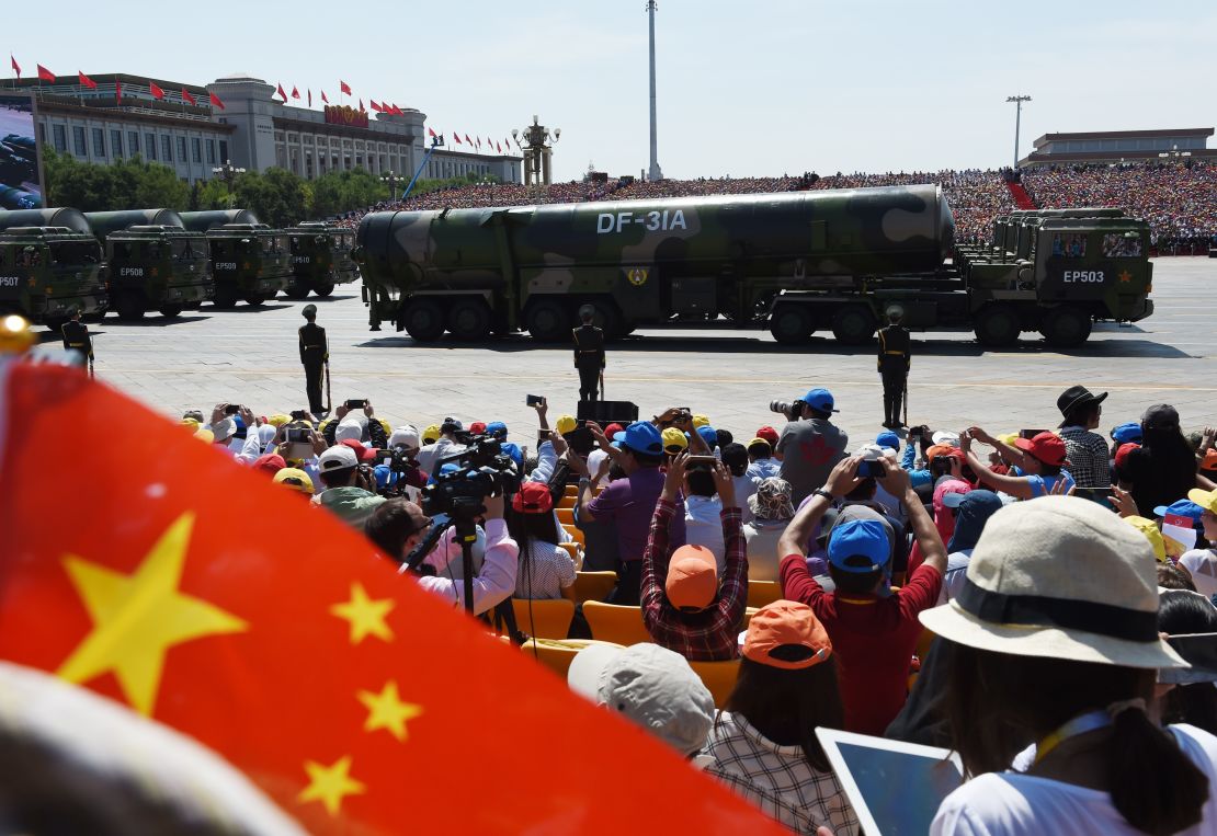 Military vehicles carrying DF-31A missiles are displayed in a military parade at Tiananmen Square in Beijing on September 3, 2015.