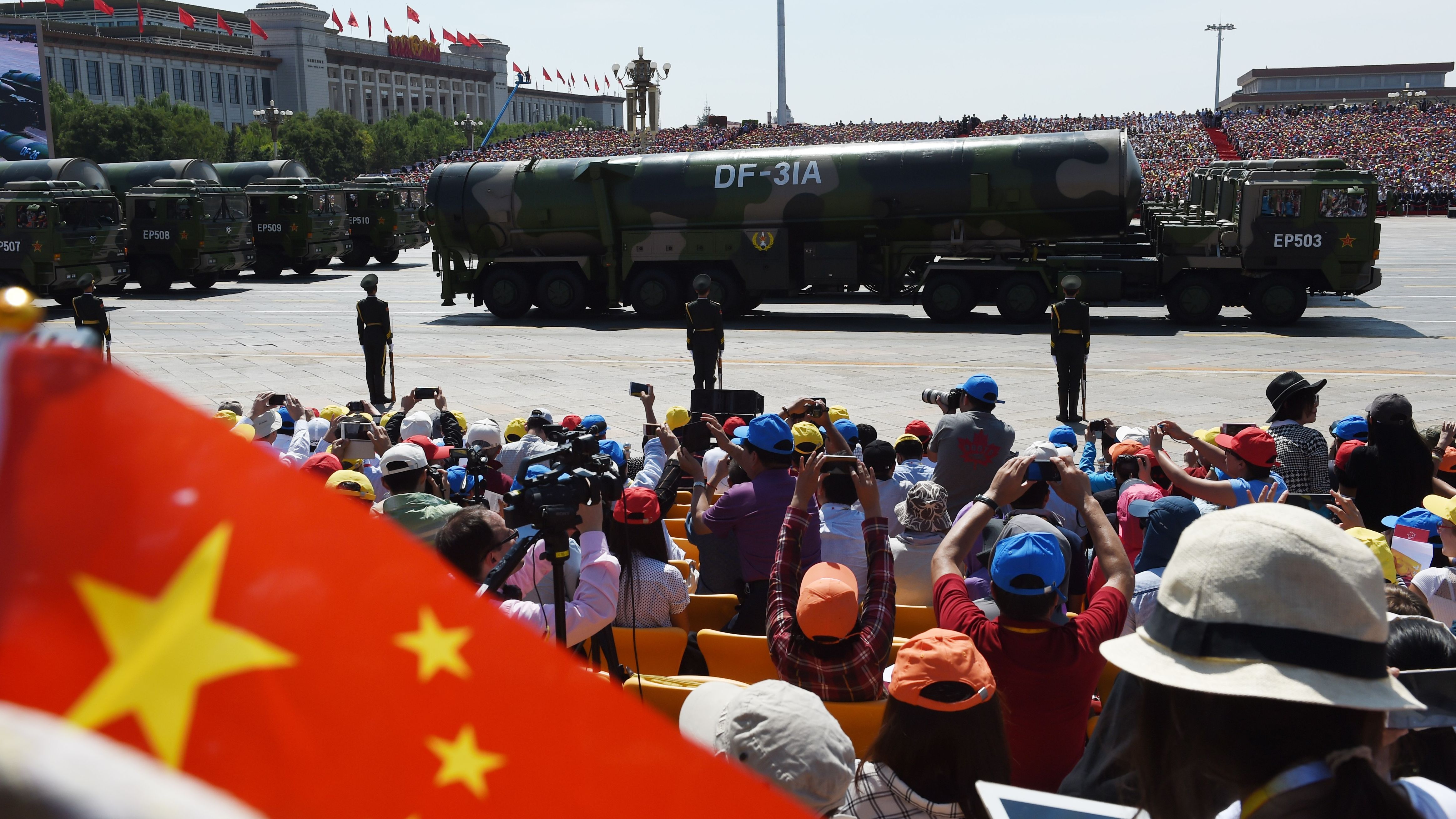 Military vehicles carrying DF-31A missiles are displayed in a military parade at Tiananmen Square in Beijing on September 3, 2015.