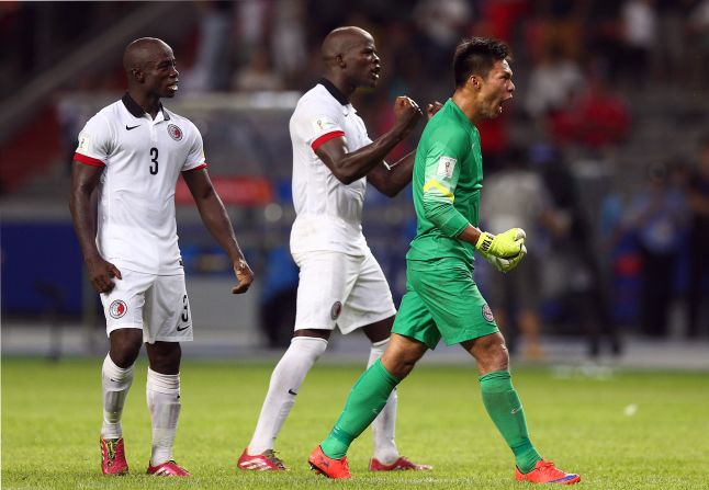 Hong Kong goalkeeper Yapp Hung Fai and his teammate revel in the result. China had 41 shots on goal.