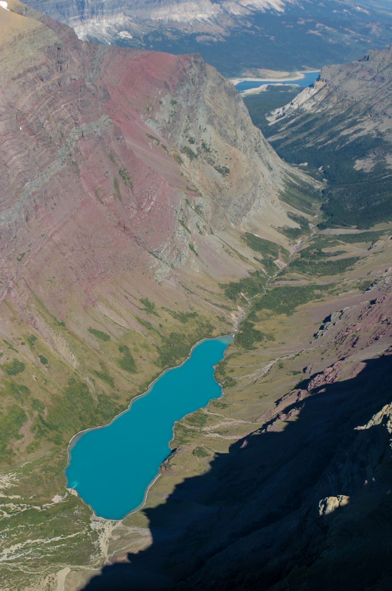 At just over 10,000 feet in elevation, Mount Siyeh in Glacier National Park has spectacular summit views. The north face drops more than 4,000 feet to the turquoise-colored Cracker Lake.