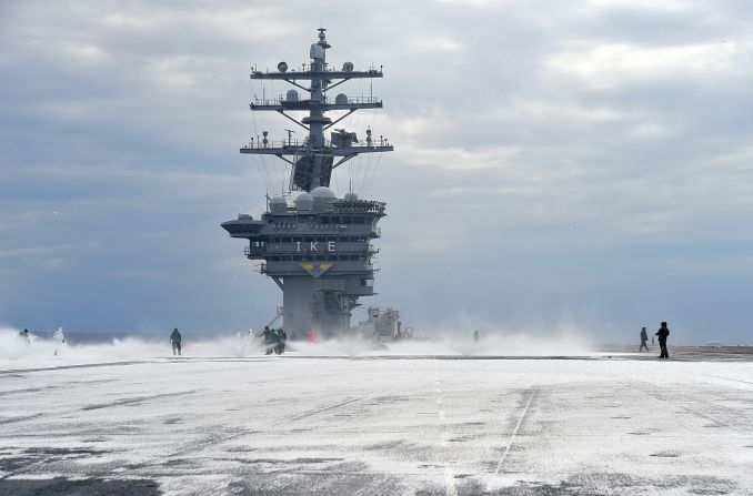 Sailors test the countermeasure washdown system on the flight deck of the Nimitz-class aircraft carrier USS Dwight D. Eisenhower (CVN 69) during sea trials prior to returning to its homeport at Naval Station Norfolk in late August 2015.