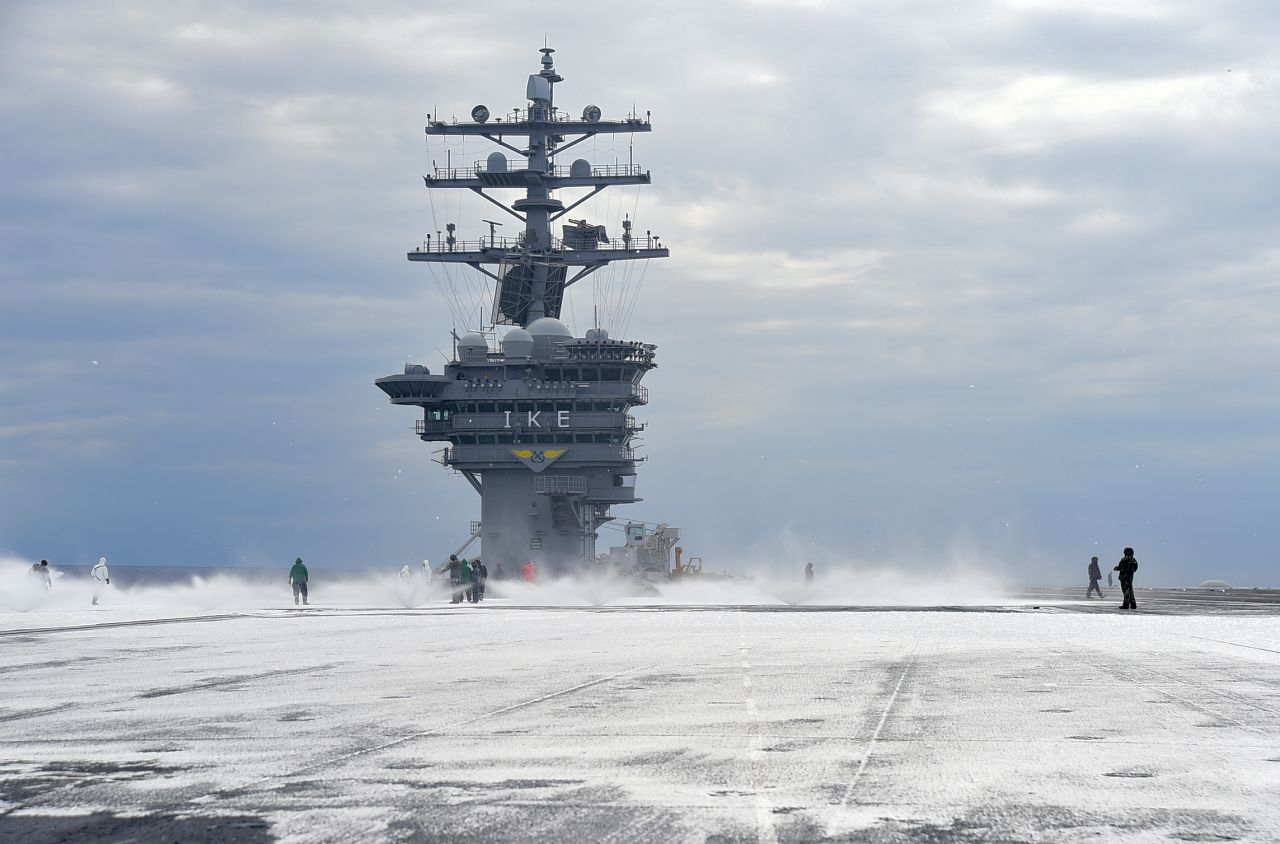 Sailors test the countermeasure washdown system on the flight deck of the Nimitz-class aircraft carrier USS Dwight D. Eisenhower (CVN 69) during sea trials prior to returning to its homeport at Naval Station Norfolk in late August 2015.  