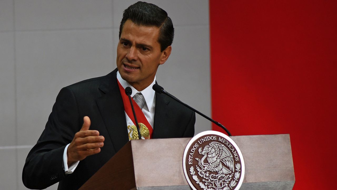 Mexican President Enrique Pena Nieto delivers his third annual report at the National Palace in Mexico City on September 2, 2015. Mexico's embattled President Enrique Pena Nieto acknowledged his country's "outrage" over a drug kingpin's jailbreak, the presumed massacre of 43 students and other scandals in his state-of-the-nation speech Wednesday. 