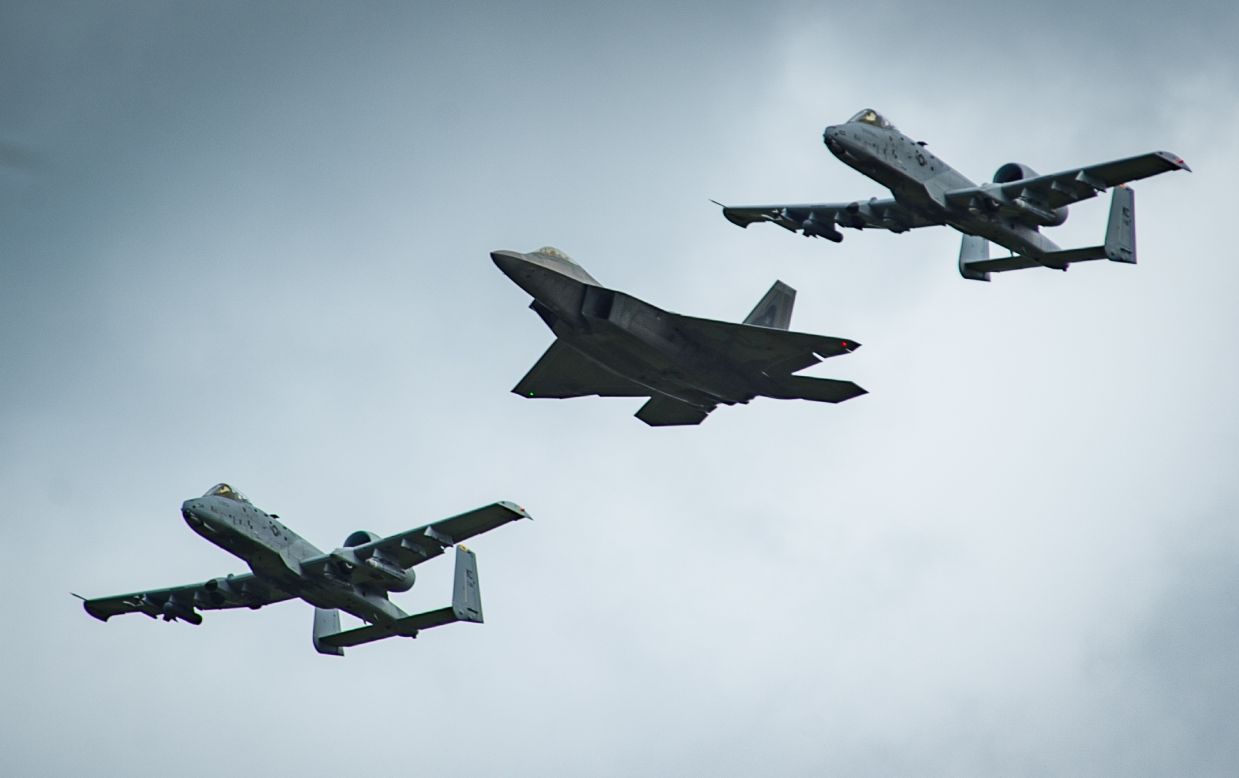 An F-22 Raptor and two A-10 Thunderbolt IIs fly overhead before landing at Amari Air Base in Estonia on September 4. The F-22 Raptor is the Air Force's most-advanced stealth fighter.
