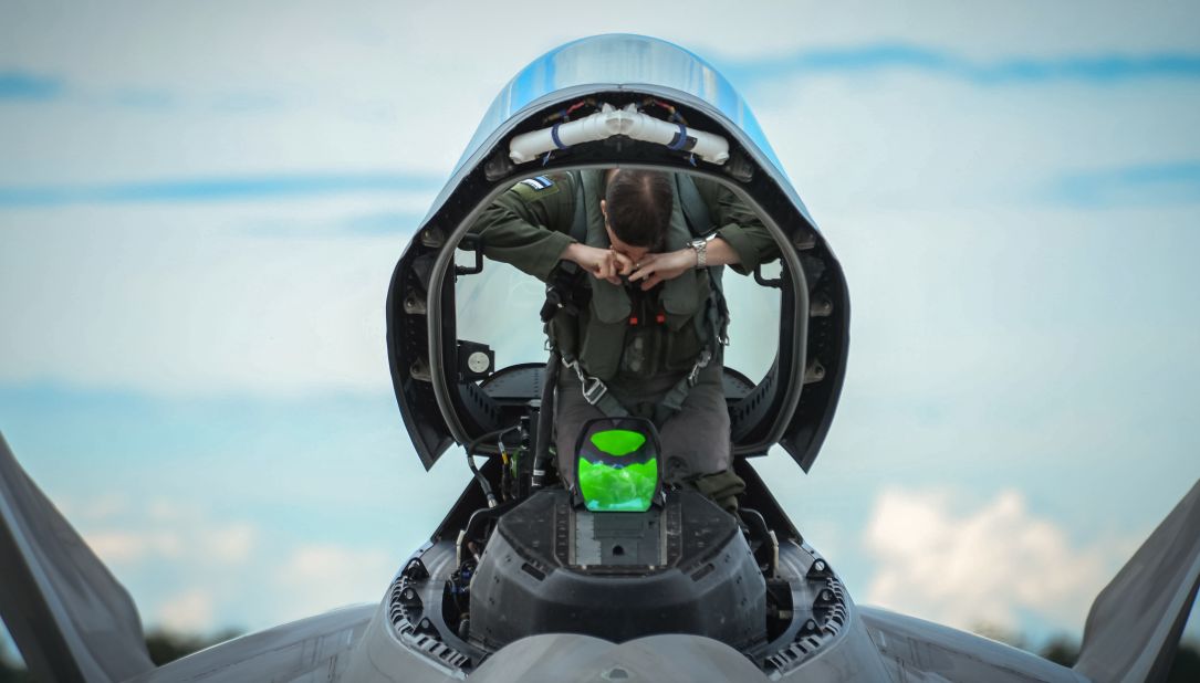 An F-22 pilot from the 95th Fighter Squadron gets situated in his aircraft before taking off from Amari on September 4.