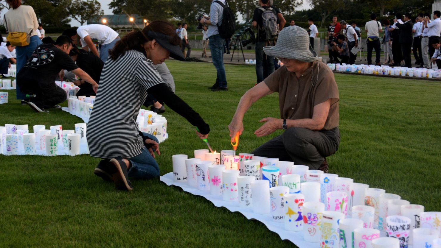 This picture taken on Friday, September 4, 2015, shows people lighting candles to celebrate at Naraha town in Fukushima as the Japanese government lifts an evacuation order to Naraha near the crippled nuclear plant, after a clean-up program has lowered radiation levels in the area. Among communities where the entire population was forced to evacuate after the nuclear crisis started in March 2011, Naraha is the first town to allow all of its residents to return home permanently.