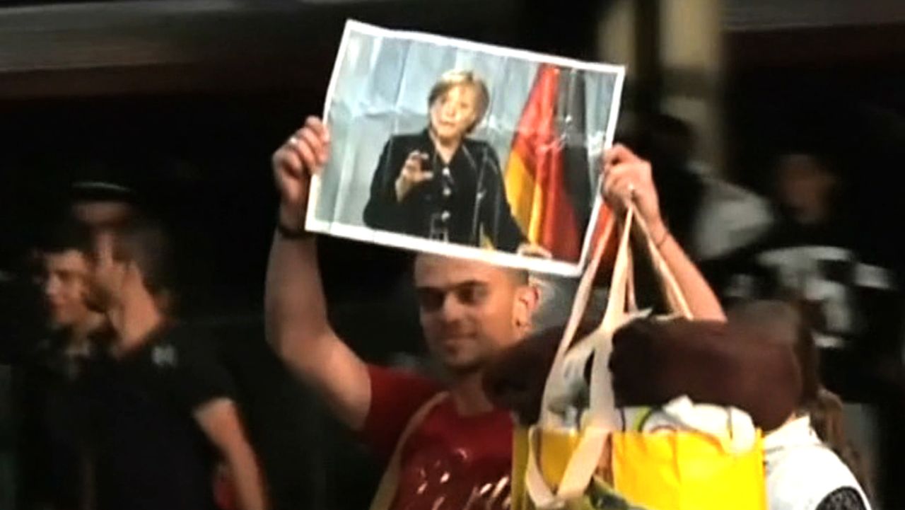 merkel hero migrant