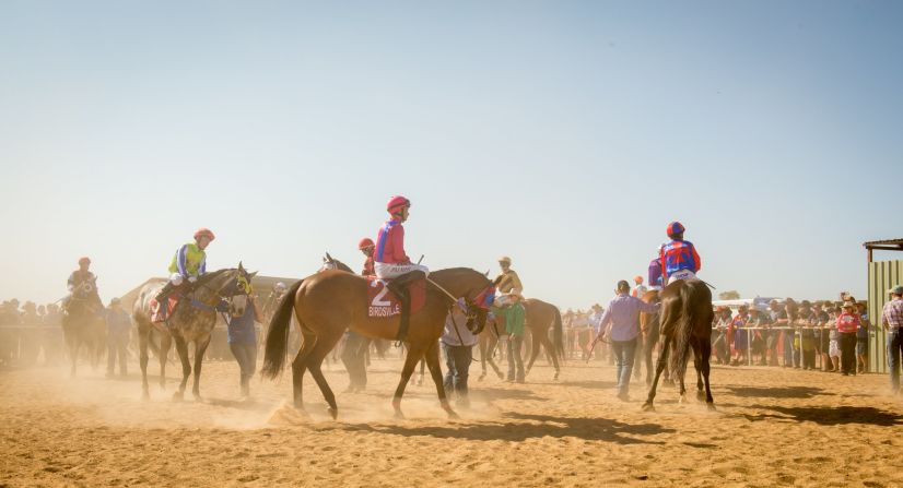 Horses and jockeys parade for the punters ahead of Saturday's big race. 