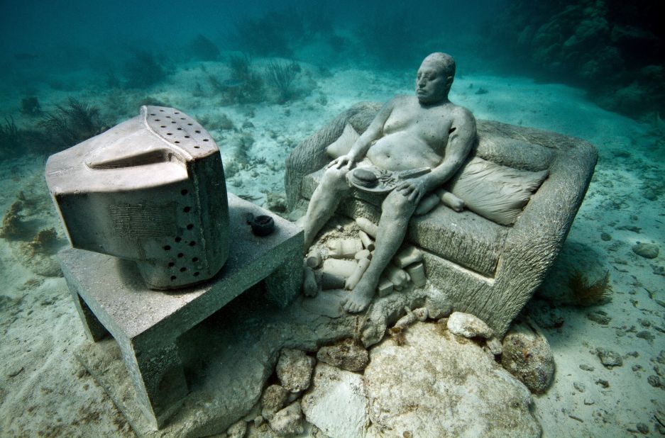 The artist makes the scuptures in Cancun, as heavy as possible so they would stay on the seabed once secured. Works are made of PH neutral cement, and over time sponges and coral encrust the surfaces in myriad of colorful and unexpected patterns.