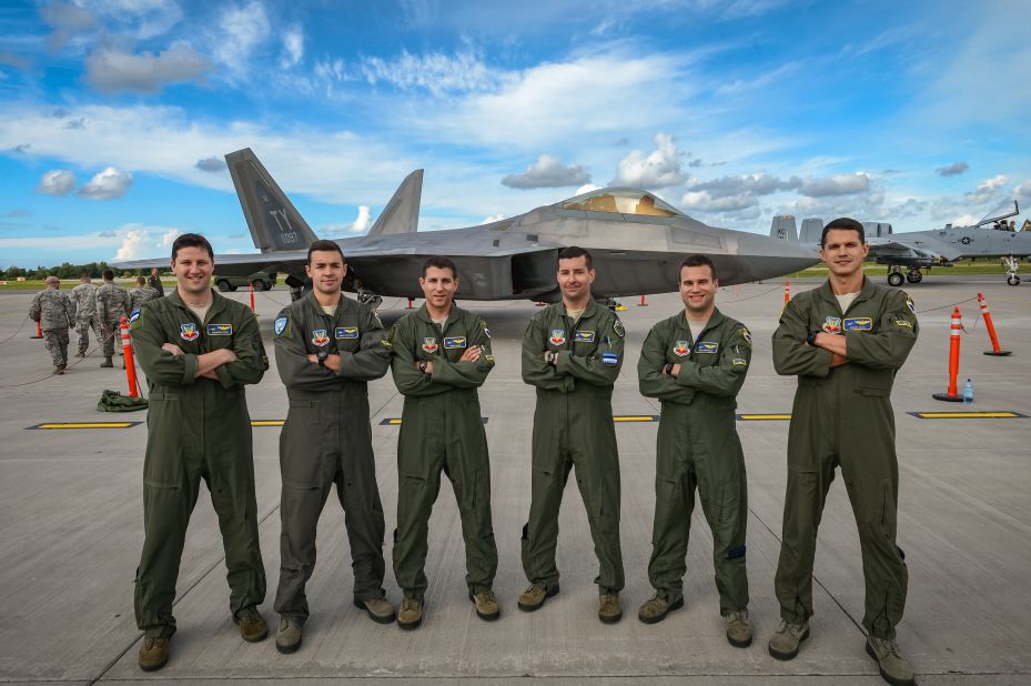 F-22 Raptor pilots appear with one of their jets at Amari on September 4.