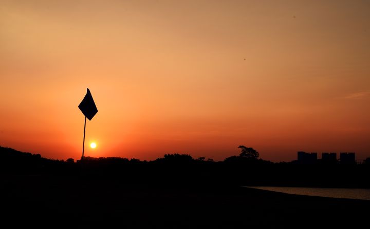 Slightly hazier perhaps, but no less stunning. The sun drops at the Shenzhen International at Genzon Golf Club in Shenzhen, China.