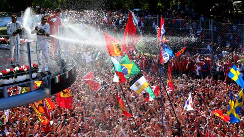 Formula One driver Lewis Hamilton showers a crowd after winning the Italian Grand Prix on Sunday, September 6. Hamilton, last year's Formula One champion, has won seven of this year's 12 races.