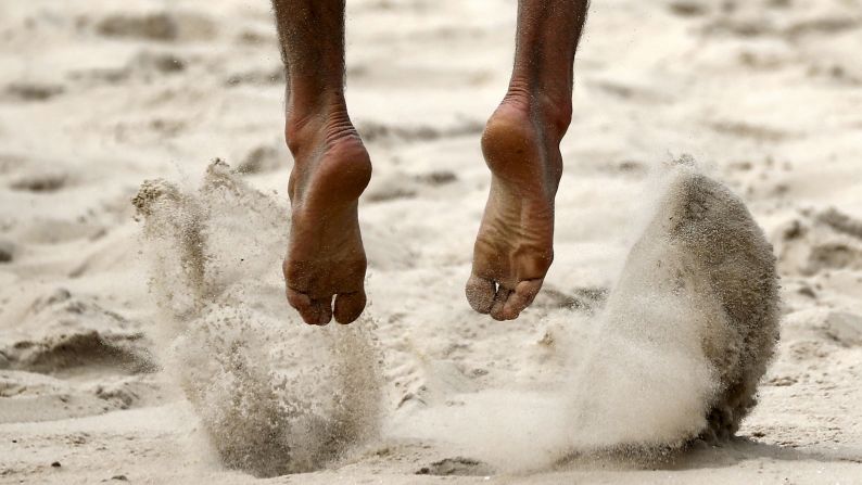 Austria's Christoph Dressler jumps for a block during a beach volleyball match in Rio de Janeiro on Friday, September 4. The tournament held there was a test event for next year's Olympic Games.