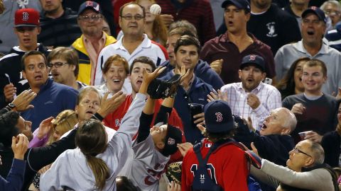 Boston Red Sox catcher Ryan Hanigan watches fans catch a foul ball during a Major League Baseball game in Boston on Friday, September 4.