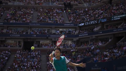 Roger Federer returns a shot to Philipp Kohlschreiber during their third-round match at the U.S. Open on Saturday, September 5. Federer won in straight sets.