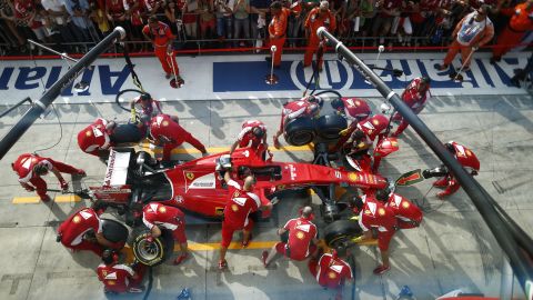 Sebastian Vettel's pit crew works on his Formula One car Thursday, September 3, in Monza, Italy. Vettel finished second in the Italian Grand Prix.