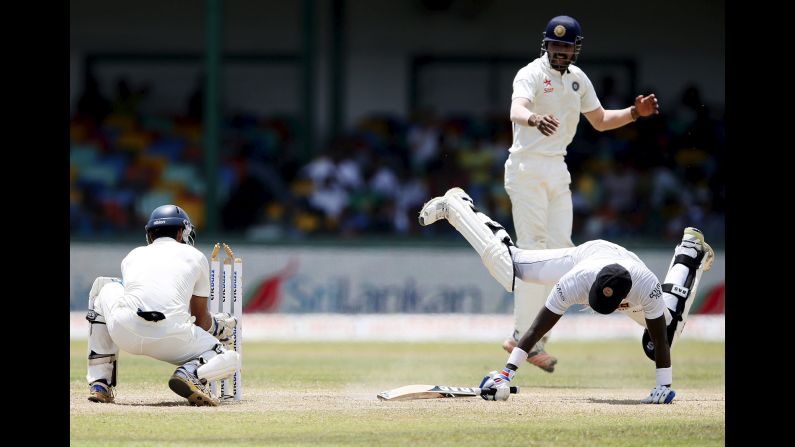 Sri Lanka captain Angelo Mathews, right, dives to avoid a run out during a Test match against India on Tuesday, September 1.