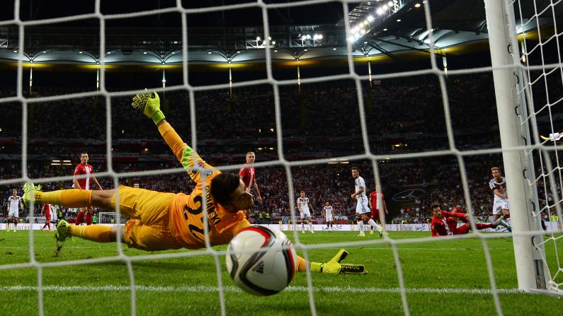 Germany's Mario Gotze, far right, scores a goal against Poland during a Euro 2016 qualifying match played Friday, September 4, in Frankfurt, Germany. Germany won the match 3-1.