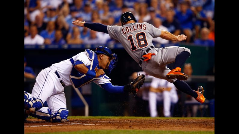 Tyler Collins of the Detroit Tigers is tagged out at home plate by Salvador Perez during a game in Kansas City, Missouri, on Tuesday, September 1.