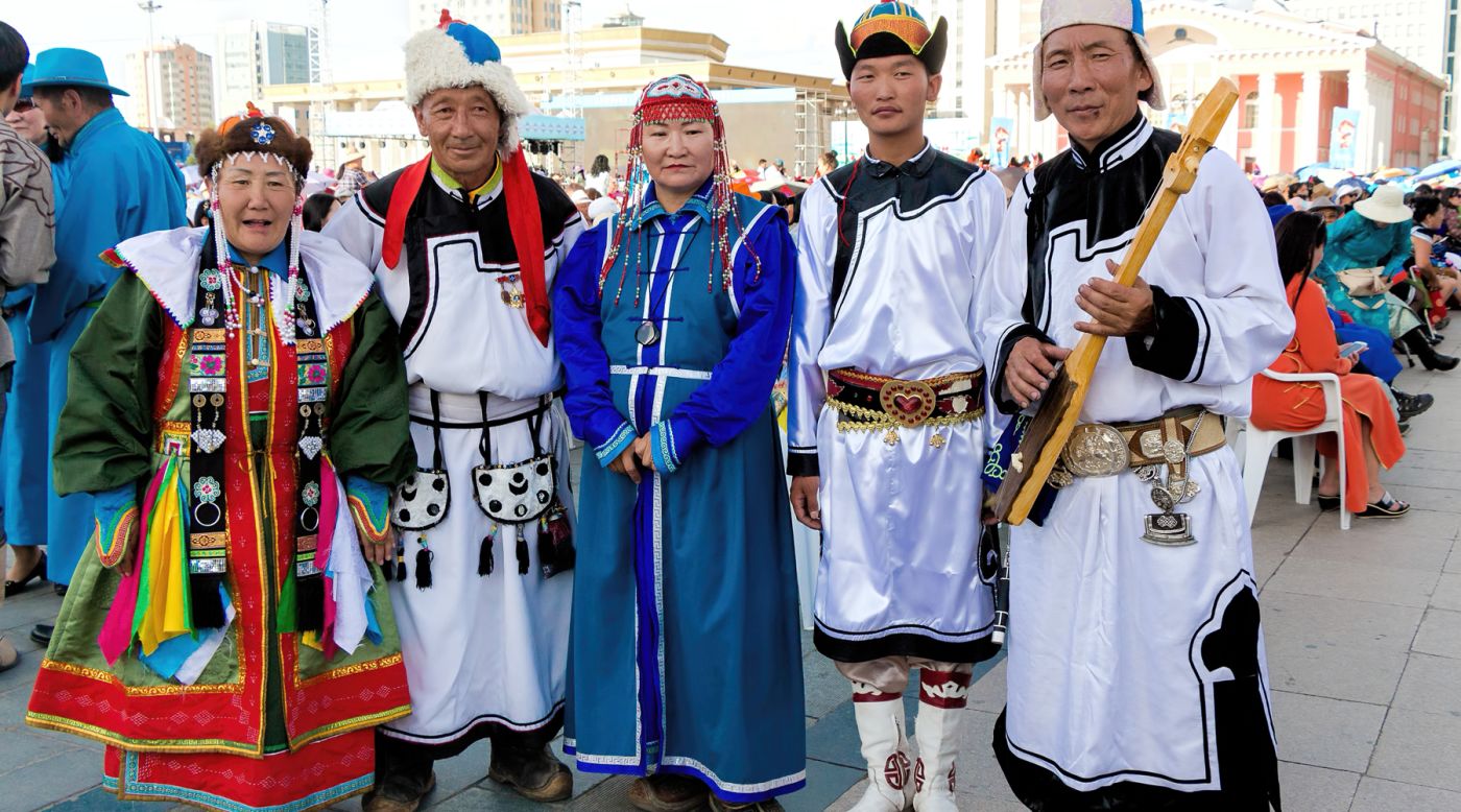 Commonly worn by both men and women, especially by herders, the traditional Mongolian costume called deel is as ancient as the country itself.<br />The deel, similar to a robe with no pockets is worn with a thin silk sash tightly wound around the waist. <br />The belt is used to carry items like chopsticks, snuff bottles and pipe pouches. Toothpicks, ear scratchers and tweezers can also be carried.<br />Different styles of deel reflect the age of the wearer. <br />Older people typically wear something modest and plain while married woman are distinguished by more elaborate dresses.<br />