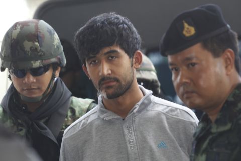 Thai security officials escort bombing suspect Yusufu Meerailee, arrested last week near the Cambodian border, as he is transferred from military to police custody at the metropolitan police headquarters in Bangkok on September 7, 2015.
