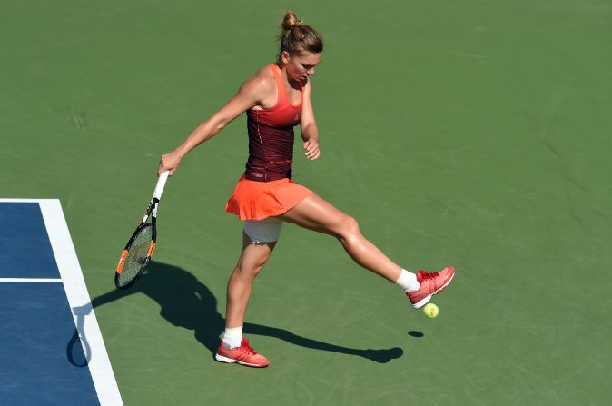 No. 2 seed Simona Halep of Romania kicks the ball after losing a game to Sabine Lisicki of Germany during their fourth round match. After a heat break before the third set, Halep went on to win the grueling match to advance to the quarterfinals. 