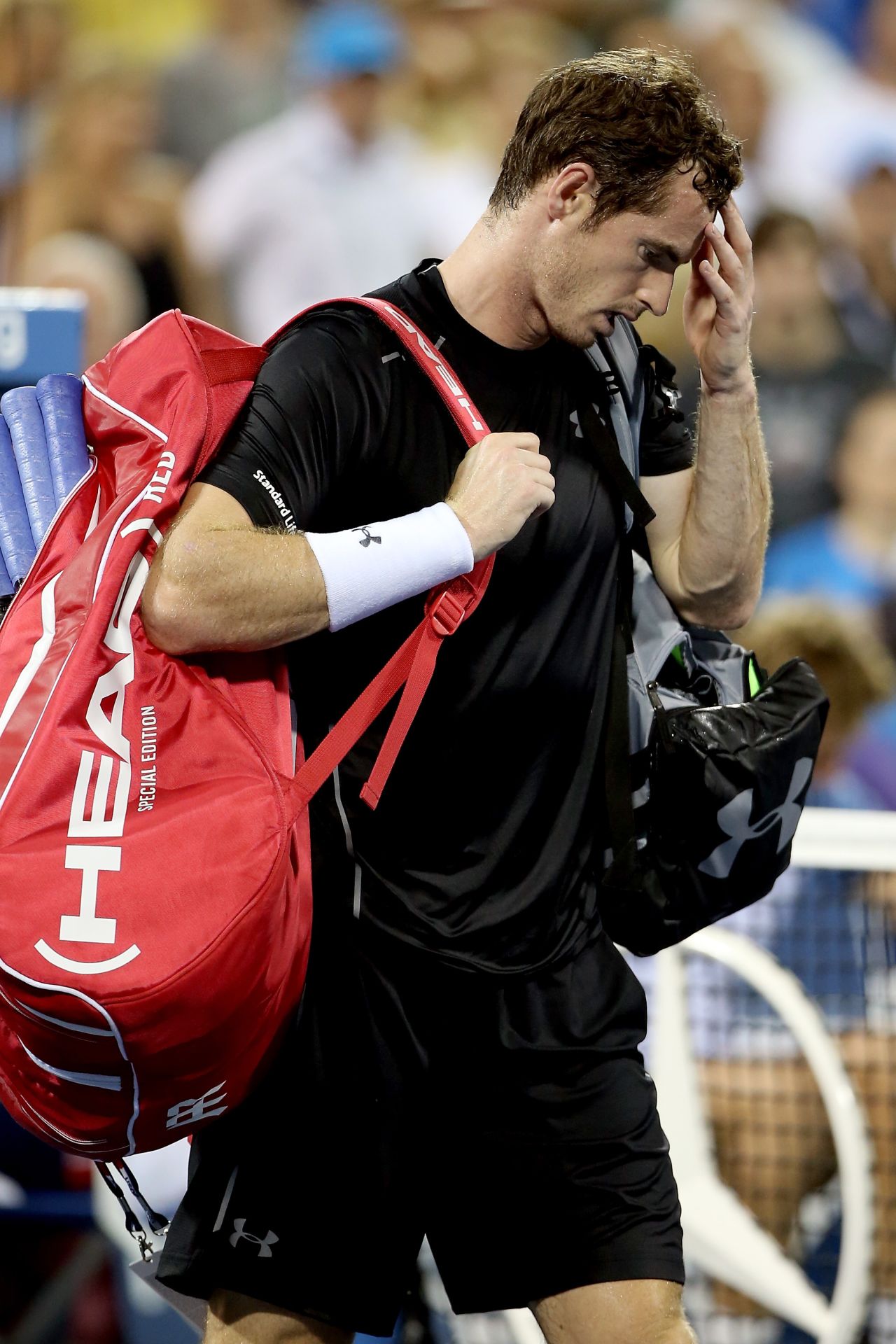Andy Murray leaves the court after losing to Kevin Anderson during their men's singles fourth round match at the 2015 U.S. Open on September 7, 2015 in Queens, New York.