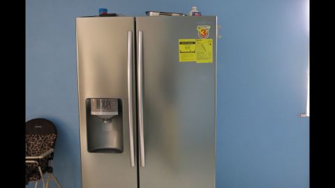 This refrigerator sat in the suspect's newly renovated kitchen. Authorities said scammers often talk their victims into sending new appliances to them. They planned to track the origins of this fridge.