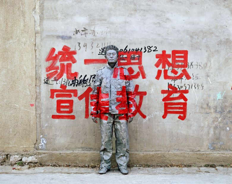 Big, four-character red slogans are commonly found throughout China. They are used to spread propaganda and political messages. <br />