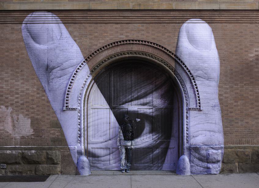 Liu Bolin collaborated with French street artist JR on this work. Liu hides himself in one of JR's large-scale murals in New York City.<br />