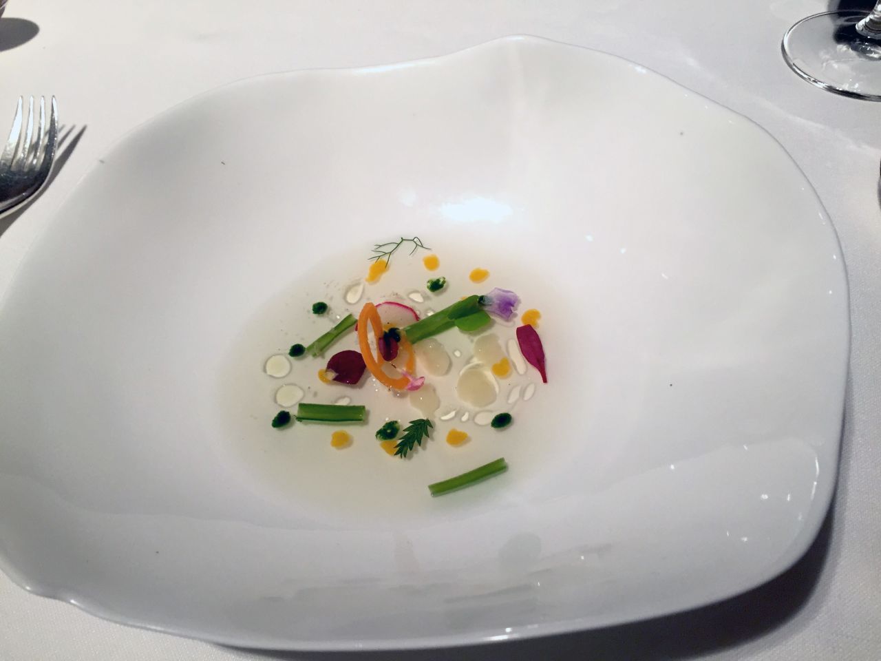 One of 21 courses served at El Celler de Can Roca during its 2014/2015 dining season, Summer Vegetable Stock is a vegetable emulsion with gelatinous drops of vegetables and a colorful sprinkling of flowers and leaves. The restaurant will offer a new menu when it re-opens its doors on September 14 following its annual summer recess. 