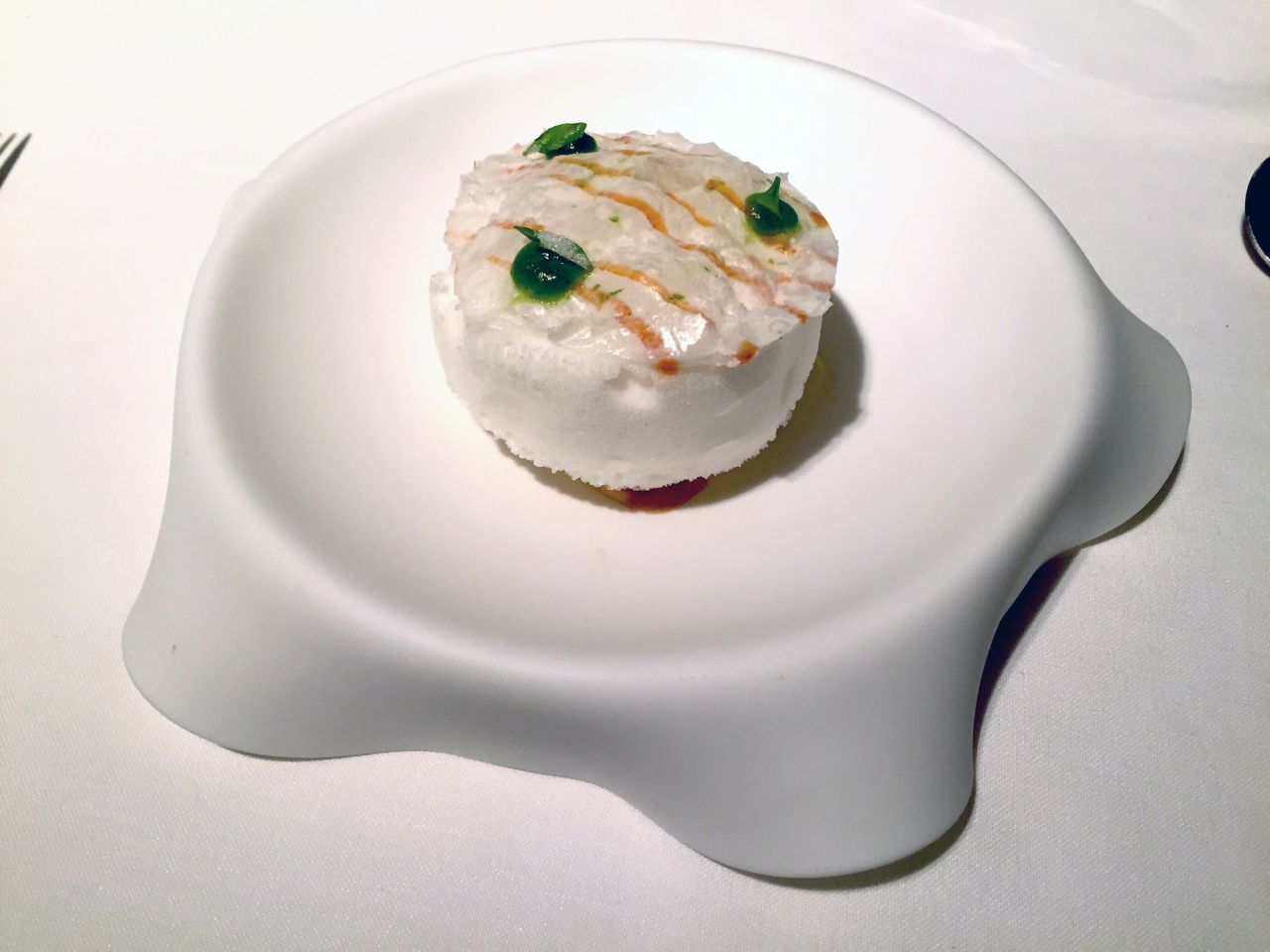 Suspiro Limeno, made with milk, lime, coriander, milk caramel and pisco. 
