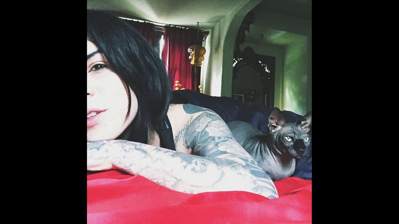 Tattoo artist Kat Von D lies in bed with a cat on Thursday, September 3. "Good morning!" <a href="https://instagram.com/p/7LHGXNFSfl/?taken-by=thekatvond" target="_blank" target="_blank">she said on Instagram.</a>