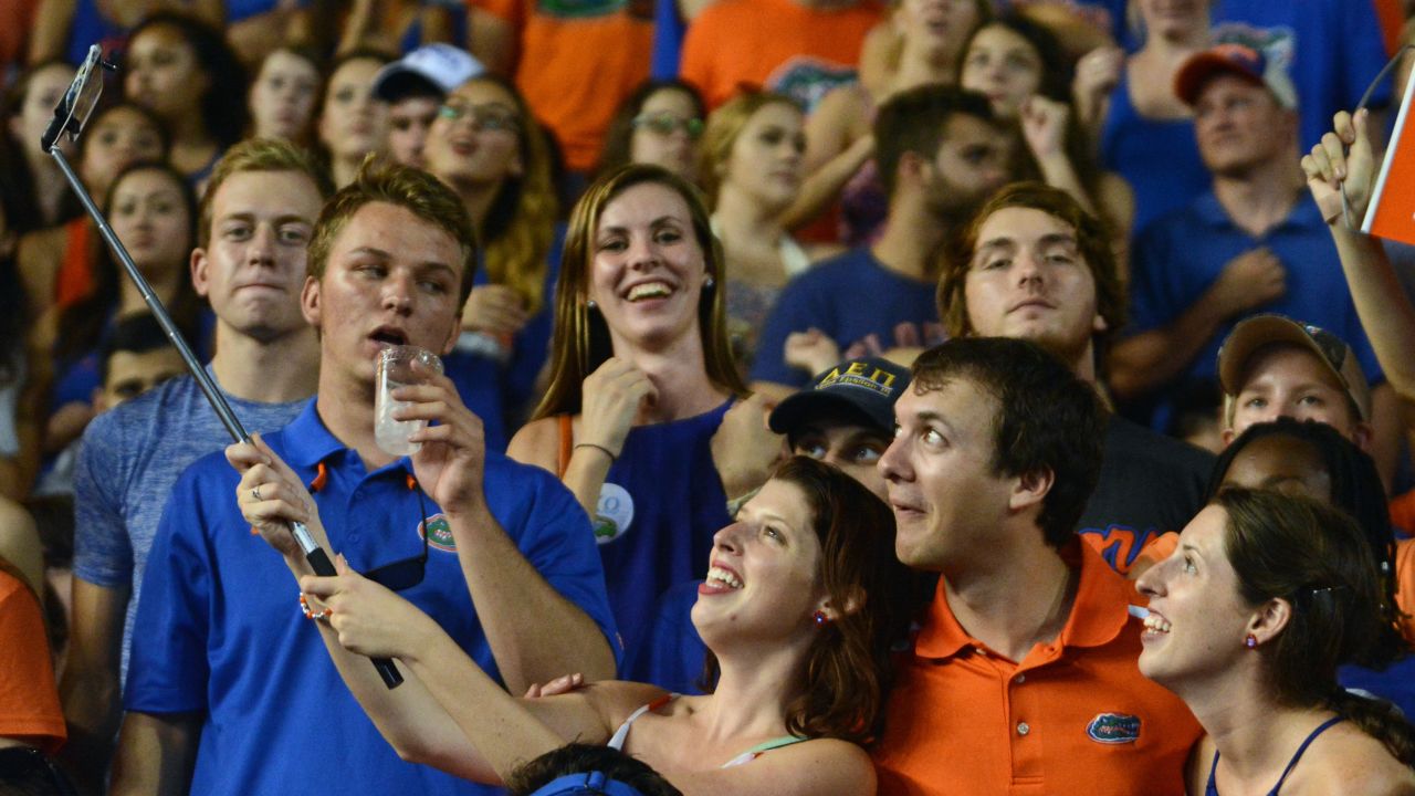 Fans take a selfie during a college football game at the University of Florida on Saturday, September 5.