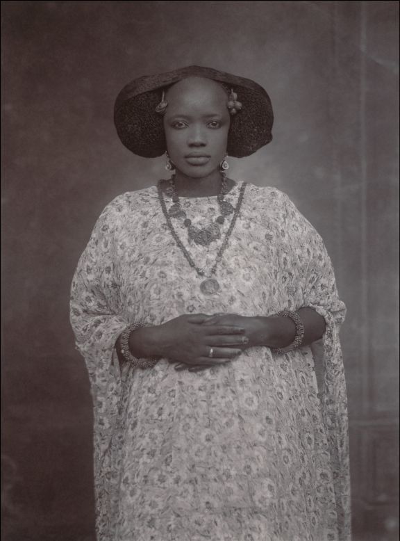 Over a century's worth of portraits detailing the intimate lives of West Africans have gone on show for the first time in New York. The exhibition at The Metropolitan Museum of Art, titled "<a href="http://www.metmuseum.org/about-the-museum/press-room/exhibitions/2015/in-and-out-of-the-studio" target="_blank" target="_blank">In and Out of the Studio: Photographic Portraits from West Africa</a>,"  looks at the earliest pioneers of African photography.<br /><br />Renowned artists such as Samuel Fosso and Seydou Keita take their place alongside many lesser known photographers in a captivating journey capturing snapshots from the lives of everyone from the metropolitan upper classes through to the very poorest rural communities in countries including Senegal, Cameroon, Mali and Gabon. Drawn deep from the museum's vaults, the exhibition features photos, cartes de visites, postcards, real photo postcards and original negatives taken between the 1870s and the 1970s.<br /><br />"The earliest images in the exhibition, taken by professional and amateur photographers in the urban centers of Ghana, Togo, and Senegal, are the most moving and should not be missed as they convey an entirely different narrative than the one disseminated through the colonial channels at the time," says curator Yaelle Biro.<br /><br />"'In and Out of the Studio' is a rare opportunity to see how photographers and sitters collaborated to fashion their sense of self and define their own modernity," she continues.<br /><br /><strong>The exhibition runs until January 3, 2016 -- Gallery 916, The Metropolitan Museum of Art, New York. Go through the gallery above to see some of the powerful images and read descriptions by the curator. </strong><br /> <br />Portrait of a Woman, ca. 1910<br />Unknown Artist (Senegal)<br />Glass negative