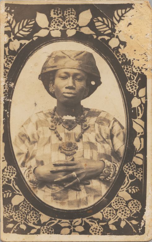 A cheaper alternative to a cabinet card or the older carte-de-viste, postcards such as this were printed directly from the negative and were far more likely to be bespoke rather than mass produced.<br /><br />Senegalese Woman, 1910s<br />Unknown Artist (Senegal)<br />Postcard format gelatin silver print