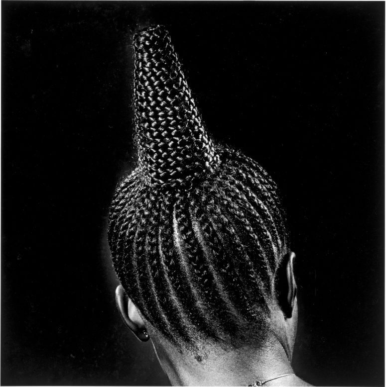 A pioneer of documentary photography, J.D. Okhai Ojeikere's series of over 2,000 negatives capturing myriad hair styles manages to convey the transience of creativity within Nigerian culture, according to Biro.<br /><br />Untitled (Modern Suku), 1975<br />J.D. 'Okhai Ojeikere (Nigerian, 1930--2014)<br />Gelatin silver print, 2009