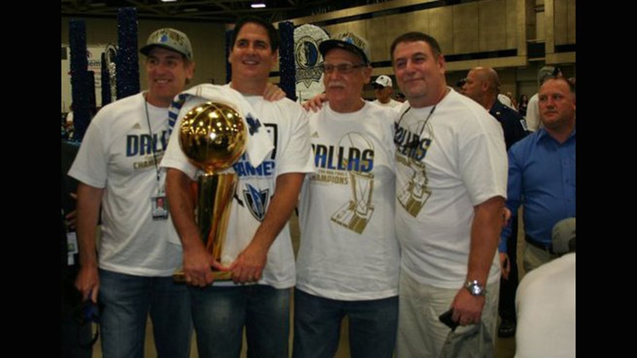 Brian Cuban, left, in 2011 next to his brother, Dallas Mavericks owner Mark Cuban, after the team's championship win. This was six years after Brian's suicide attempt.