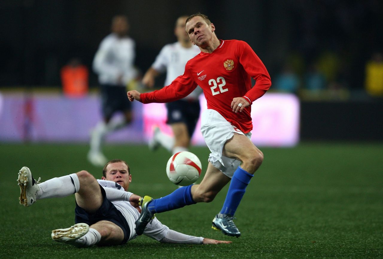 Rooney beats Aleksandr Anyukov of Russia to score during England's clash with Russia, a Euro 2008 qualifying match at the Luzhniki Stadium on October 17, 2007 in Moscow.