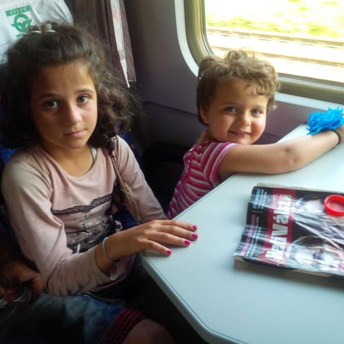 Rym, 8, and Birlnt, 2 1/2, on the train as it starts to move.