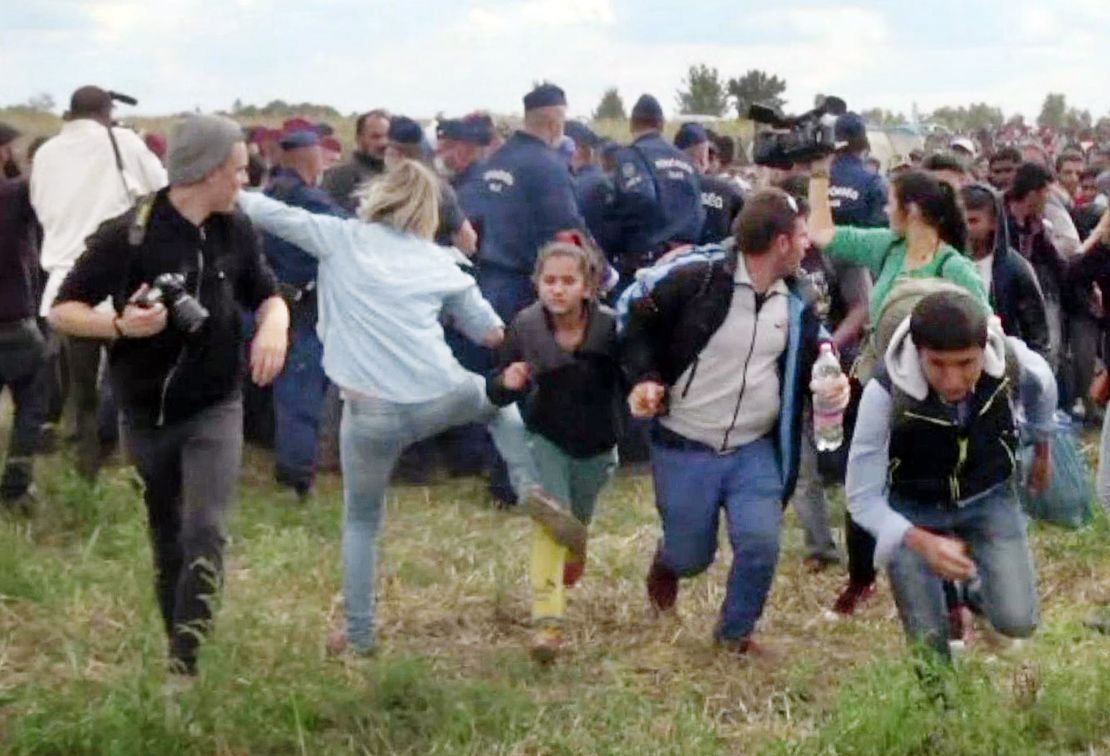 Hungarian camerawoman Petra Laszlo is seen kicking a child at a camp near Roszke, Hungary.
