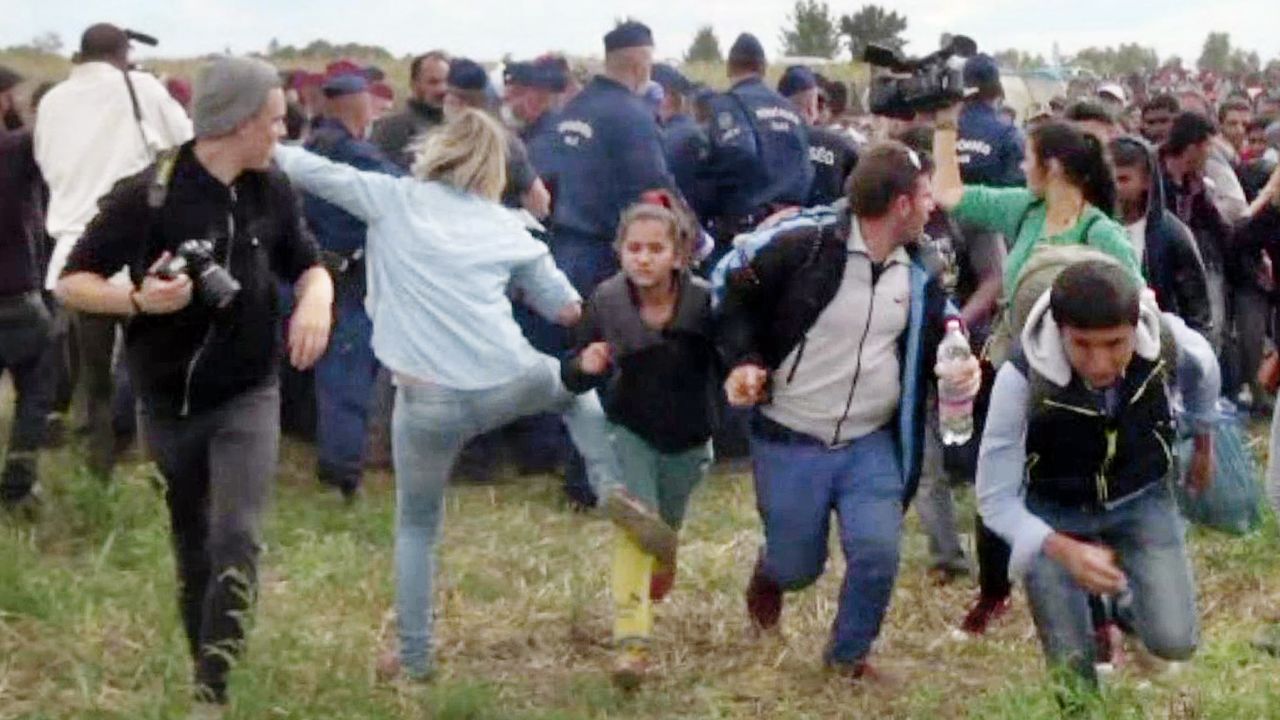 Hungarian camerawoman Petra Laszlo is seen kicking a child at a camp near Roszke, Hungary.