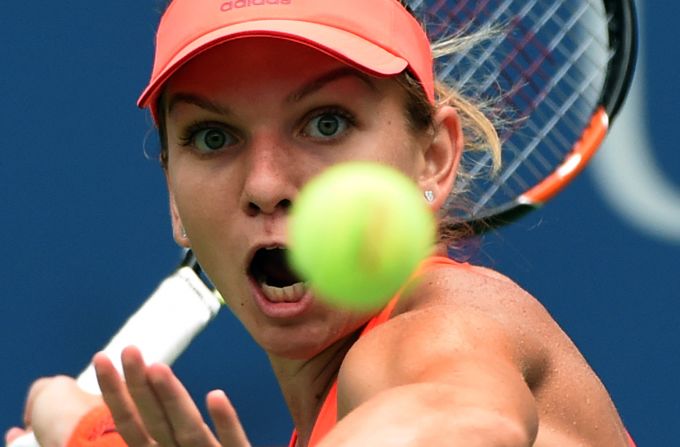 Pennetta will next face world No. 2 Simona Halep (pictured) -- who beat two-time U.S. Open finalist Victoria Azarenka in a rain-hit match.