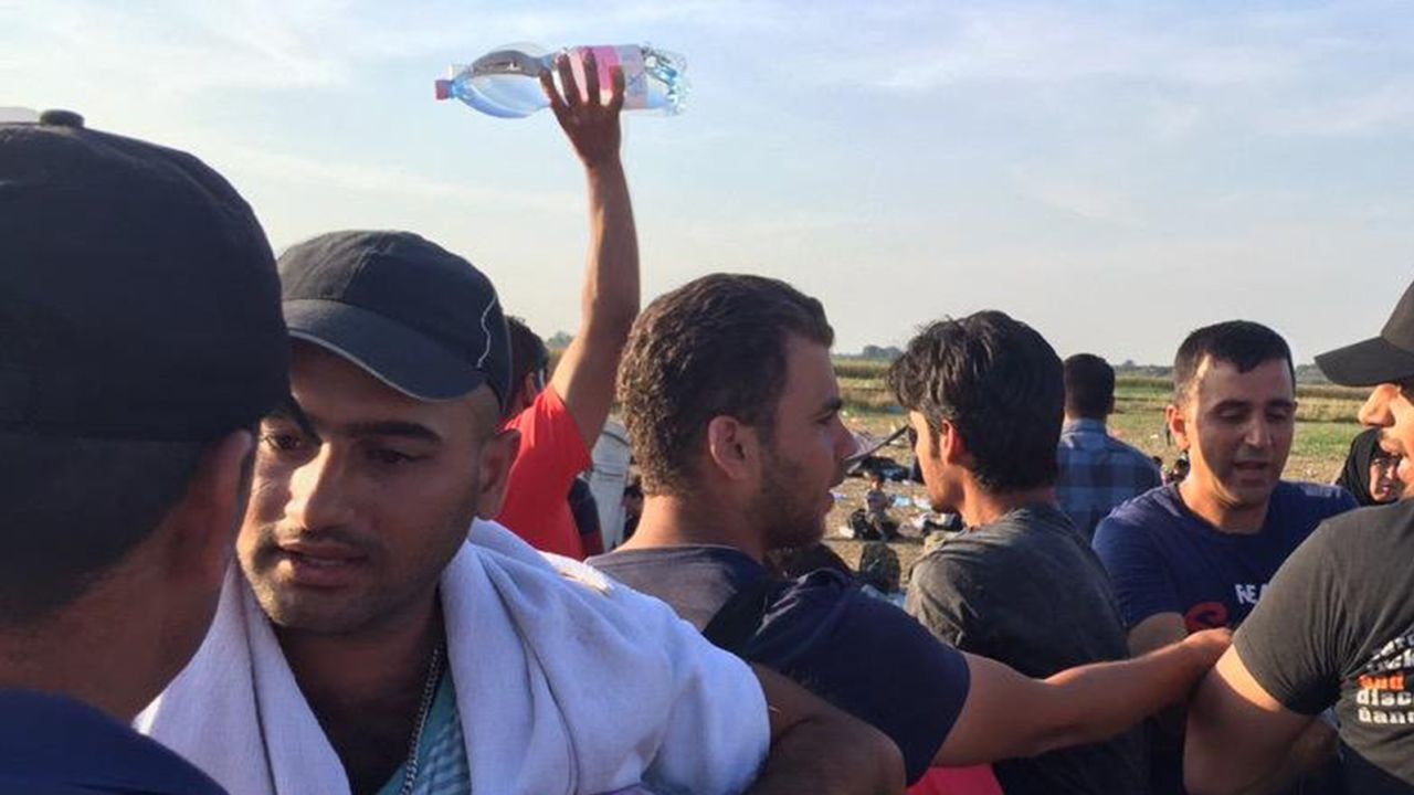 One journalist went to a store and bought water to give to the refugees.
