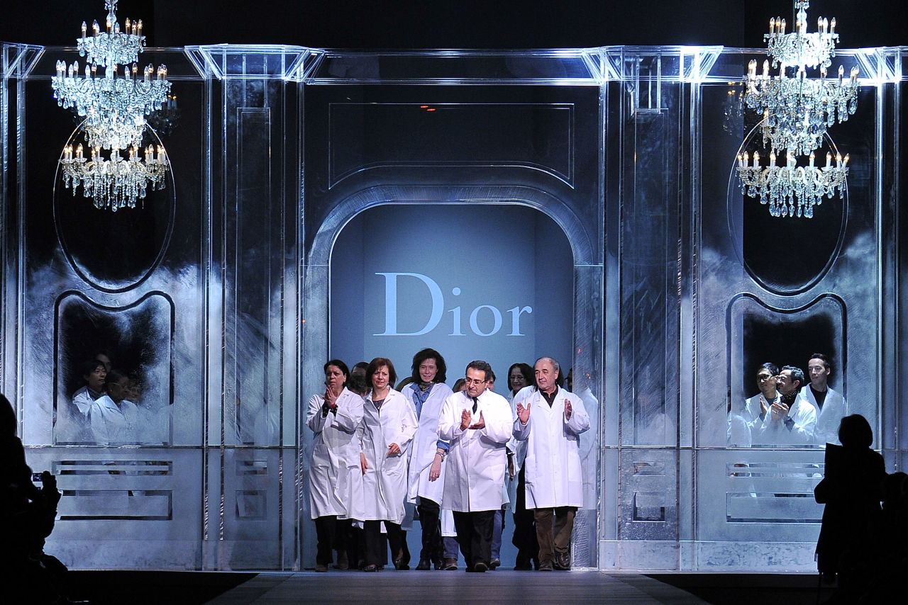 Dior closed the somber show by welcoming their seamstresses and tailors to the catwalk for the final bow. Attention was shifted from Galliano's departure to Dior's workforce. 