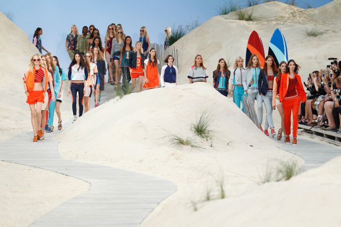 Hilfiger's Spring/Summer production turned the catwalk into an indoor beach, using a blue sky backdrop, sand and surfboards.