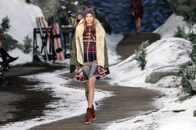Tommy Hilfiger's fall/winter 2014 show was fully inspired by the great American outdoors. He filled the stage with fake snow, ski props and little pine trees. 