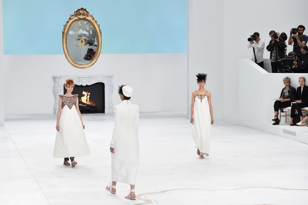 Chanel's fall/winter 2014 set in Paris was inspired by famed architect Le Corbusier. The set was in reference to Corbusier's work on a rooftop garden designed for multi-millionaire art collector Carlos de Beistegui. The production and the collection itself were both dubbed "Le Corbusier goes to Versailles." 